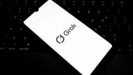 The Grok logo appears on a smartphone screen in this photo illustration (Image via Getty)