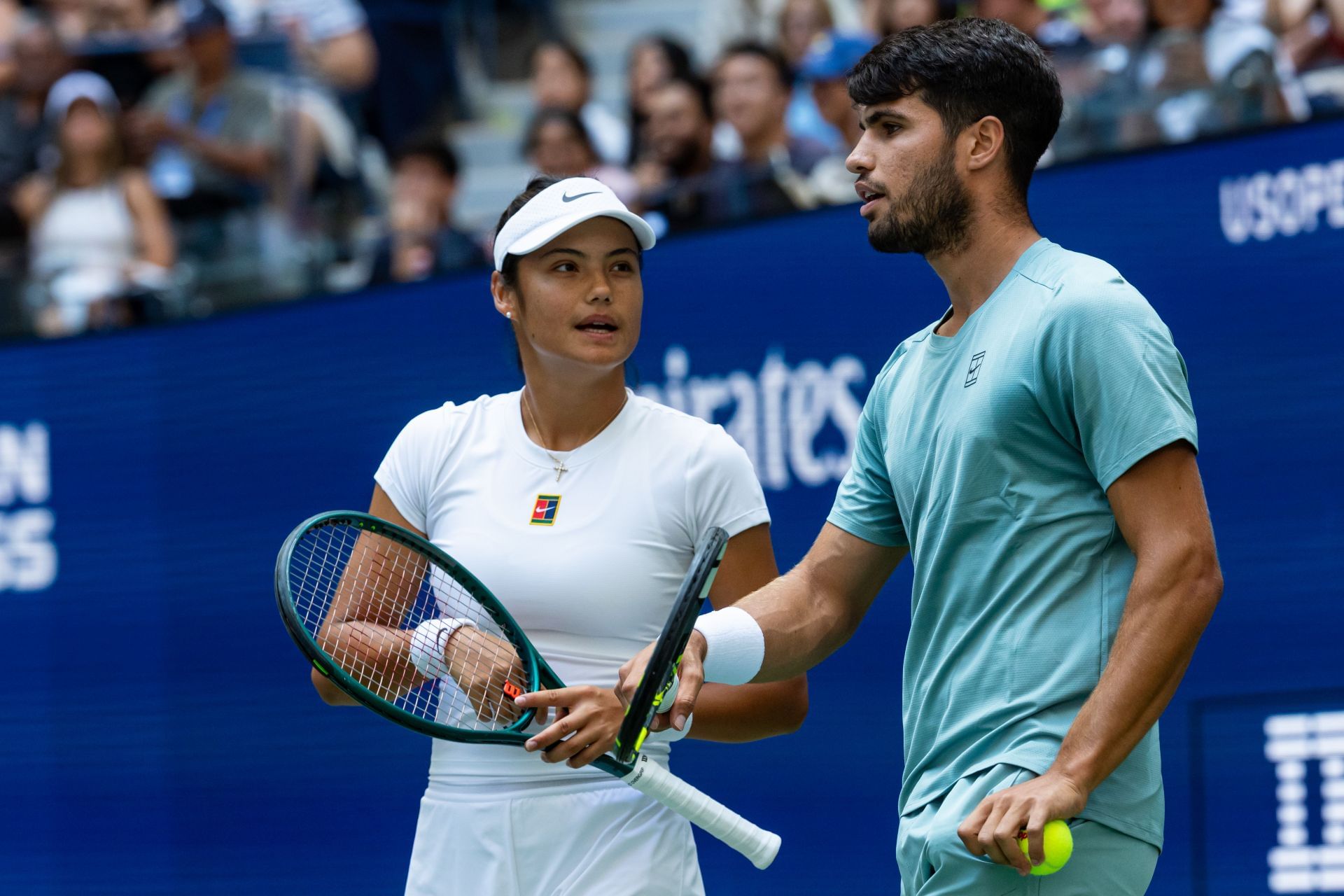 Emma Raducanu (left) and Carlos Alcaraz (right) during their first-round mixed doubles match at the 2025 US Open (Source: Getty)