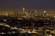 Nighttime view of the LA skyline from the Griffith Observatory, located on the southern slope of Mount Hollywood in Griffith Park, just above the Los Feliz neighborhood (Image via Getty)