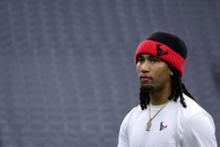 “CJ Stroud is trying to force a trade” - NFL fans react as Texans QB dons Astros rival’s hat before preseason game vs. Panthers
