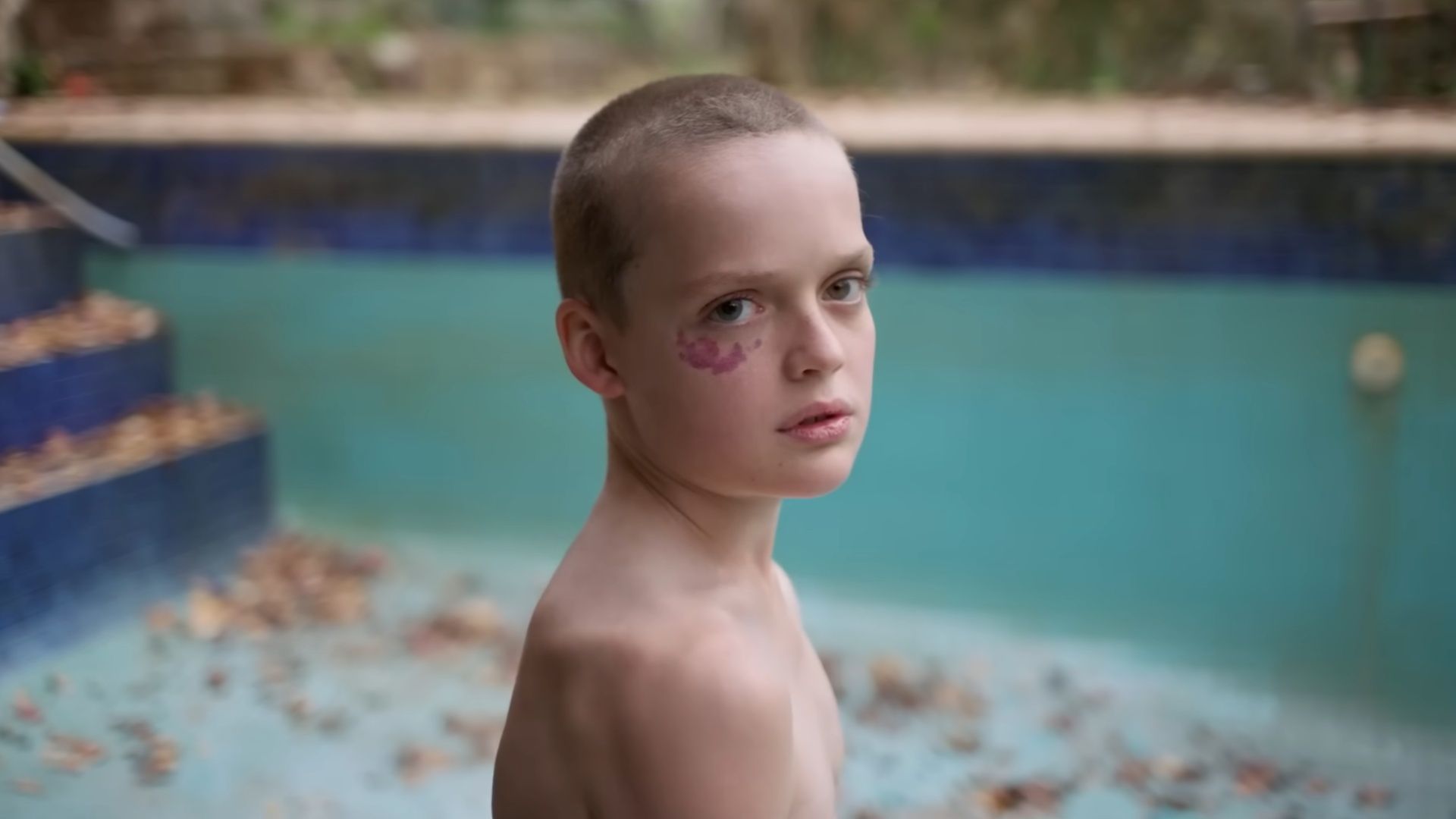 Ollie stands by the drained pool, a key location in Bring Her Back&#039;s chilling finale. (Image via A24)