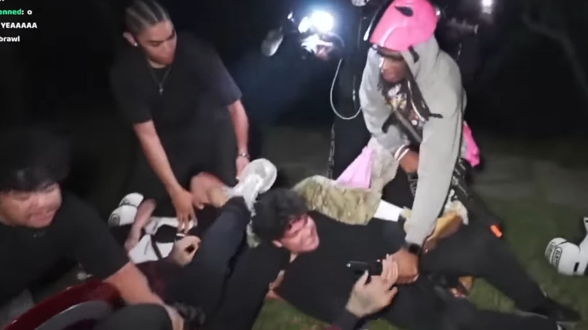 The two groups tussle on the grass (Image via plaqueboymax/YouTube)