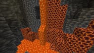 Magma Caves can have a Nether-esque theme with lava, magma blocks, and even rare netherrack (Image via Sportskeeda Gaming || Mojang Studios)