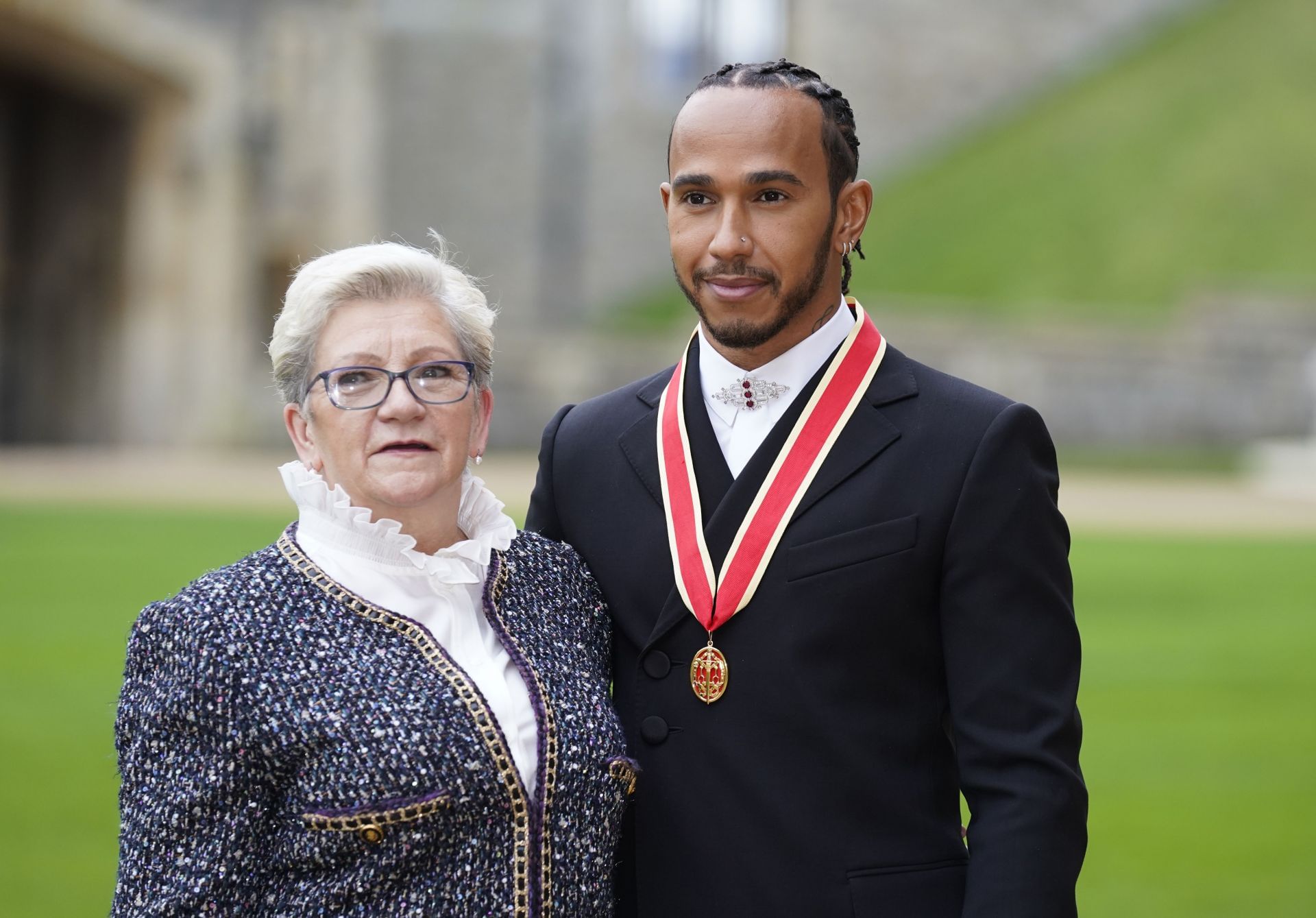 Lewis Hamilton with his mother after he was made a Knight Bachelor on December 15, 2021. Source: Getty