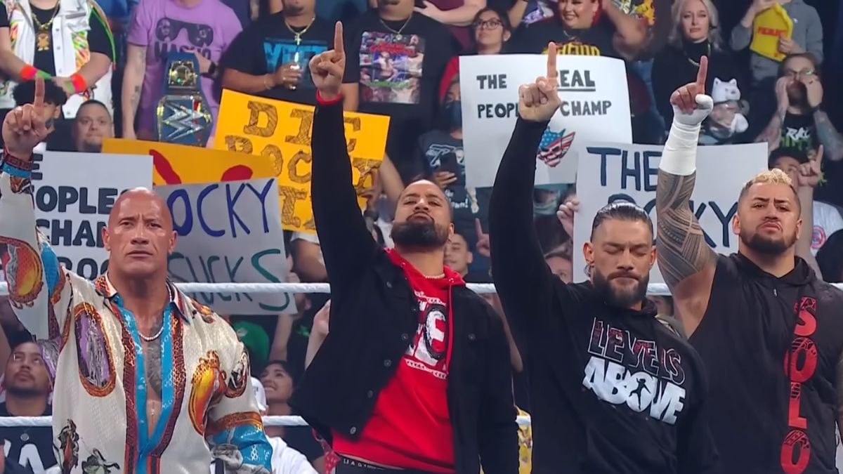 The Rock with The Bloodline. [Image via WWE YouTube]