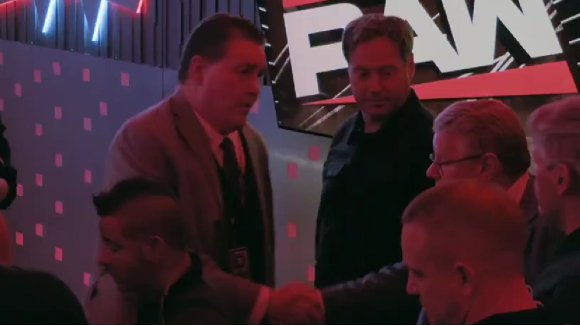 Chris Park and Bruce Prichard shaking hands on WWE: Unreal. (Photo: WWE: Unreal on Netflix)