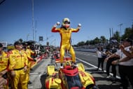 Alex Palou celebrates atop his car after winning the 2025 IndyCar title in Portland - Source: Getty