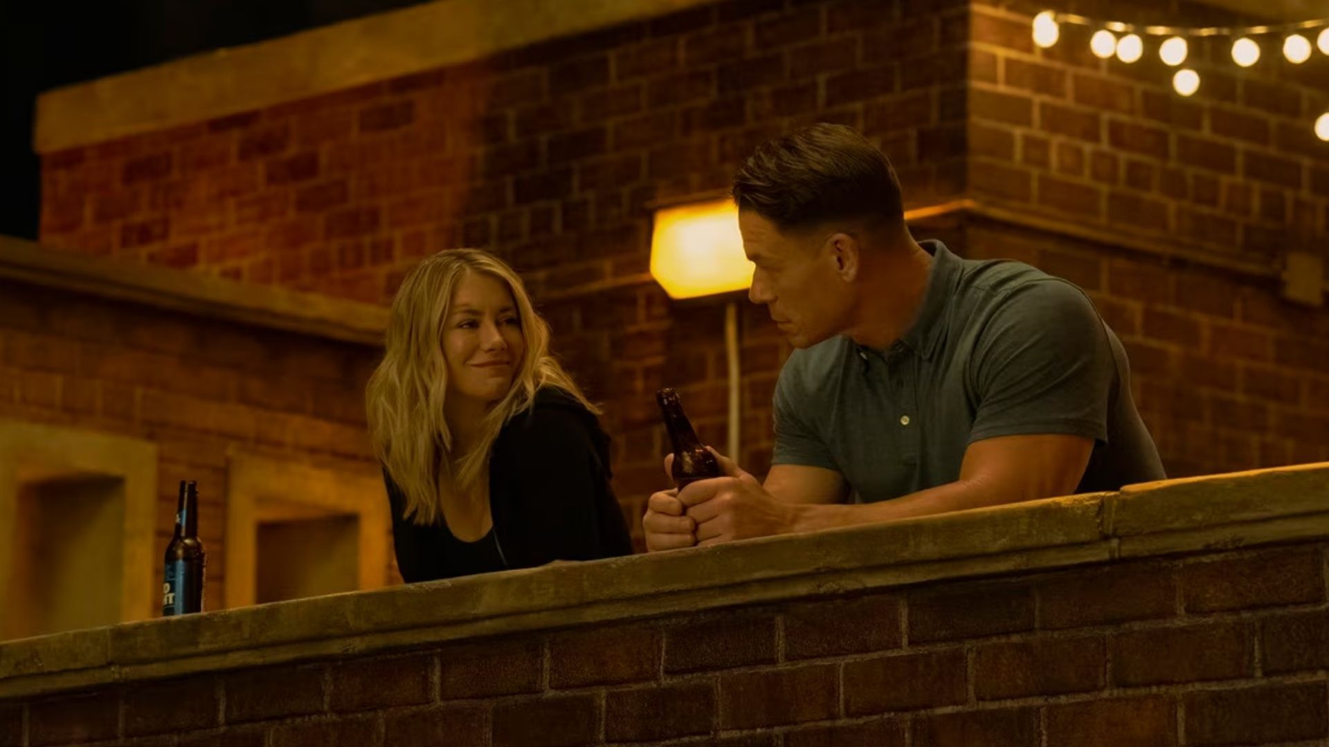 Jennifer Holland as Emilia Harcourt and John Cena as Peacemaker (Image via DC Studios)