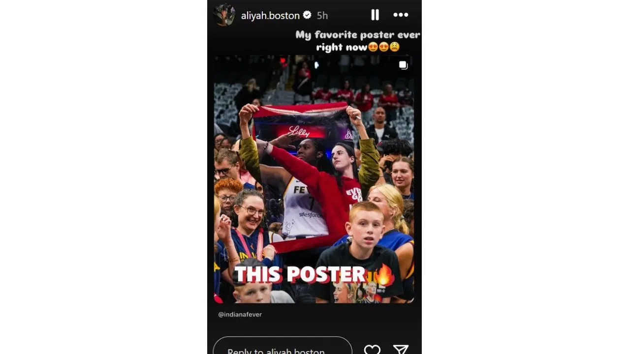 Aliyah Boston reacts to a fan bringing a poster featuring her and Caitlin Clark for the Fever-Storm game on Sunday. [photo: @aliyah.boston/IG]