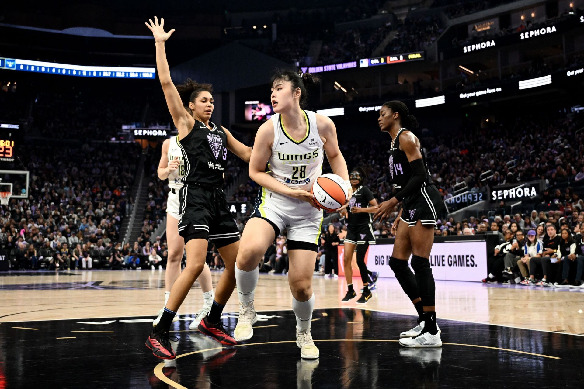 Li Yueru #28 of the Dallas Wings looks to pass over Janelle Salaun #13 of the Golden State Valkyries during the first half at Chase Center on July 25, 2025, in San Francisco, California. (Credits: IMAGN)