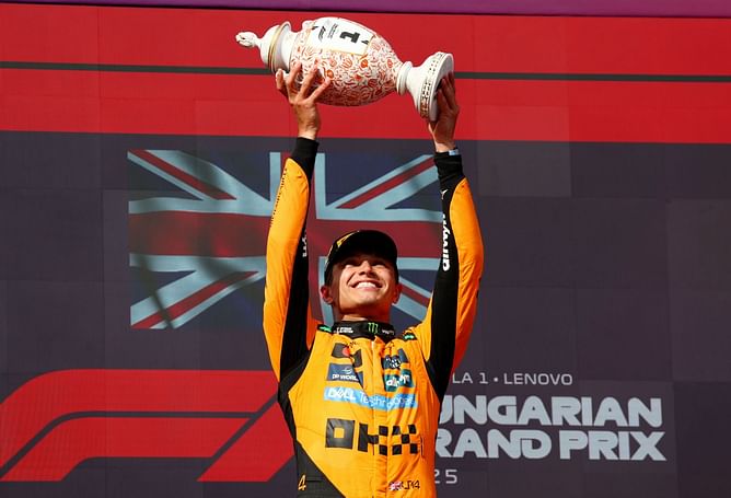 Lando Norris writes a cheeky quote on the champagne after winning the F1 Hungarian GP