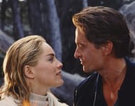 Sharon Stone and Michael Douglas on the set of Basic Instinct, directed by Paul Verhoeven (Image via Getty)