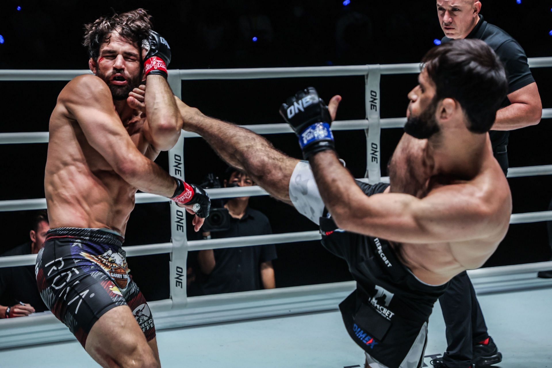 Shamil Gasanov (right) landing a kick at Garry Tonon. [Image courtesy from ONE Championship]