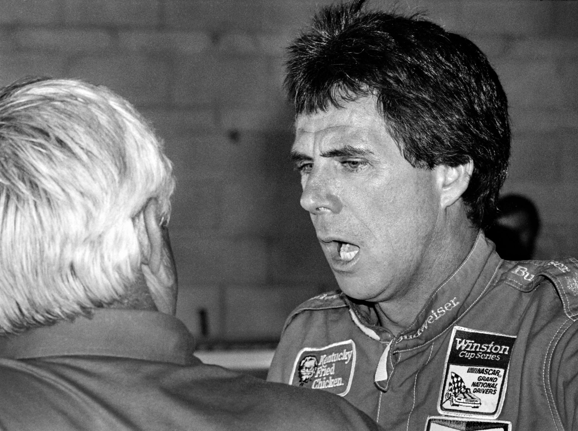 Darrell Waltrip talks with owner Junior Johnson before the 1986 Daytona 500. Source: Getty