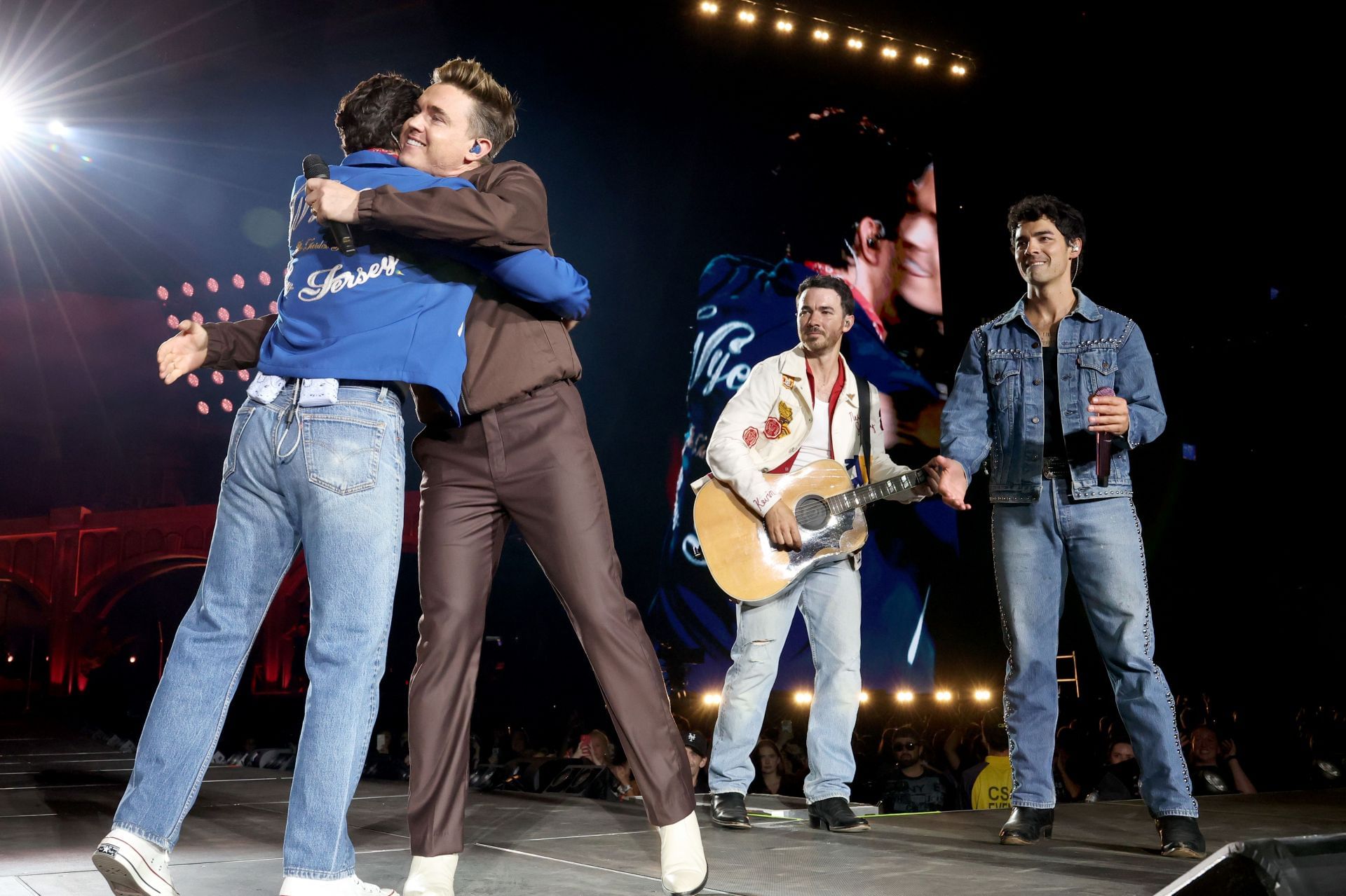 Jesse McCartney joins Jonas Brothers on stage at MetLife Stadium on Sunday. (Image via Kevin Mazur/Getty Images)