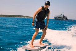 Victoria Verstappen reacts as Max Verstappen shares pictures riding a surfboard