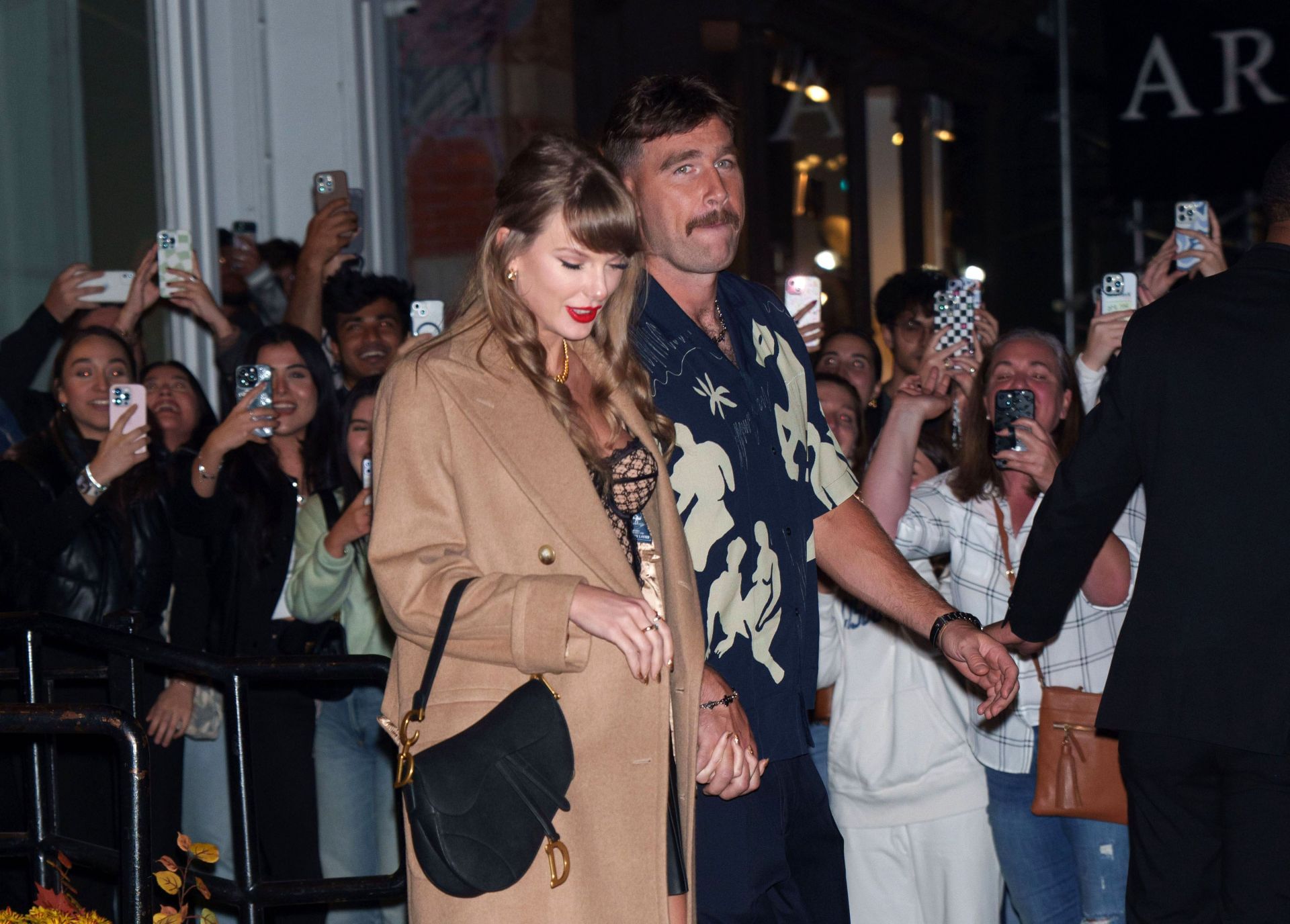 Taylor Swift and Travis Kelce seen in New York City on October 11, 2024 (Image via Getty)