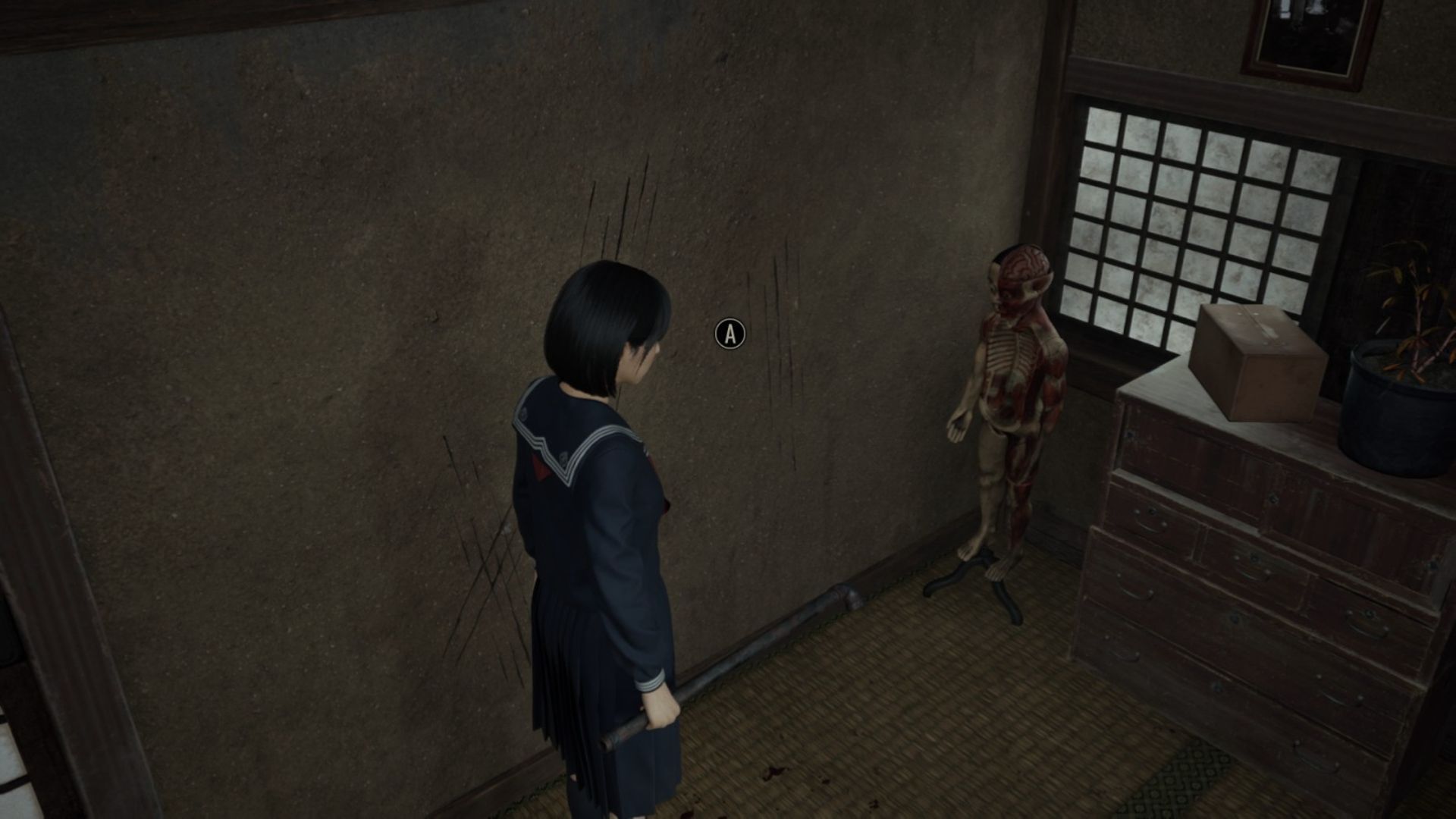The dummy near the other drawer inside the Doctor&#039;s House in Silent Hill F (Image via KONAMI)