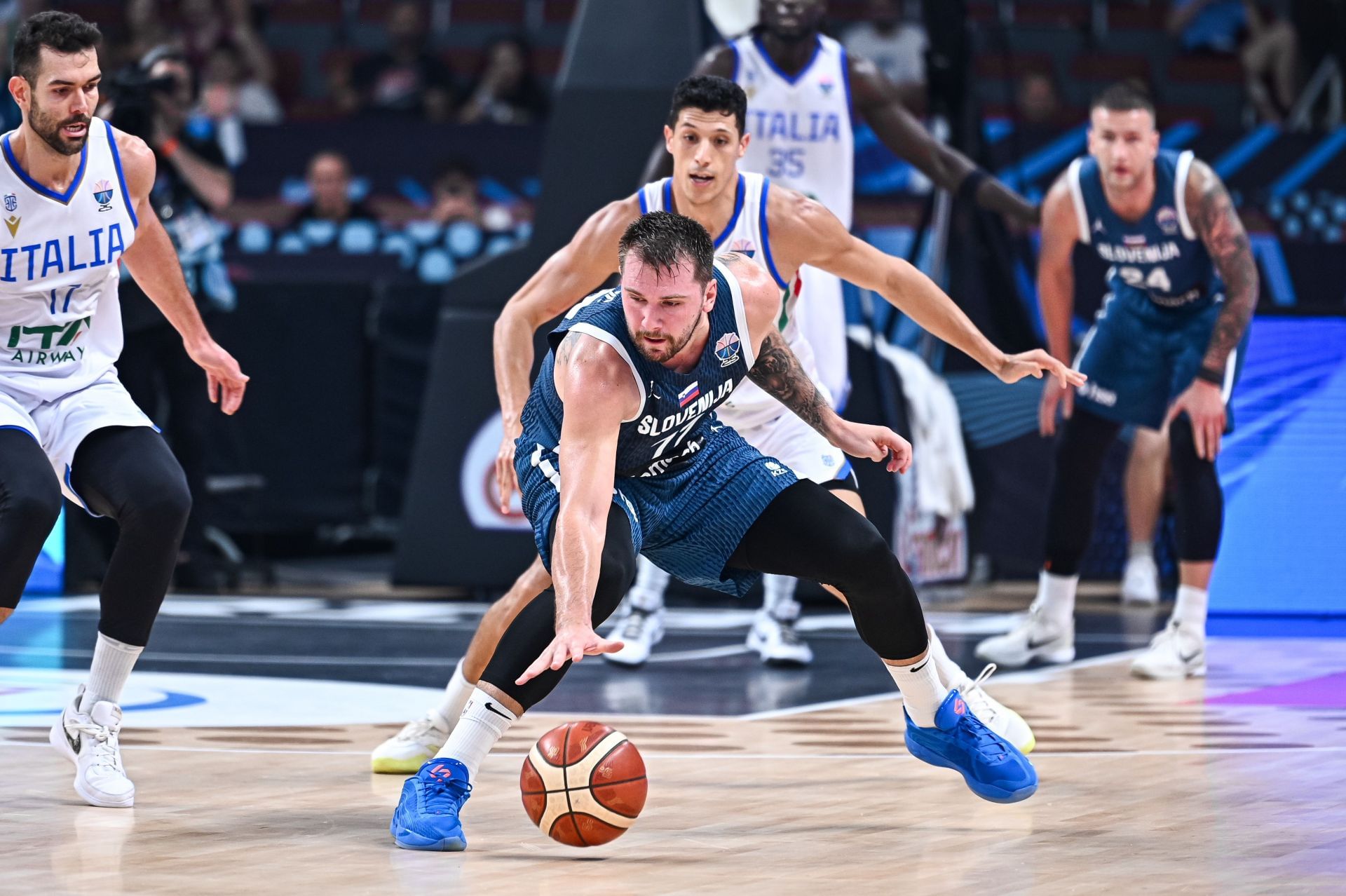 Luka Doncic of Slovenia competes with Simone Fontecchio of Italy during the FIBA EuroBasket 2025, round of 16 match between Italy and Slovenia at Xiaomi Arena in Riga, Latvia, on September 7, 2025. (Photo by Stefanos Kyriazis/NurPhoto via Getty Images)
