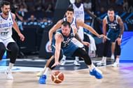 Luka Doncic de Slovenia competes with Simone Fontecchio in Italy during the FIBA Eurobasket 2025, Round of 16 games between Italy and Slovenia in Xiaomi Arena de Riga, Latvia, on September 7, 2025.
