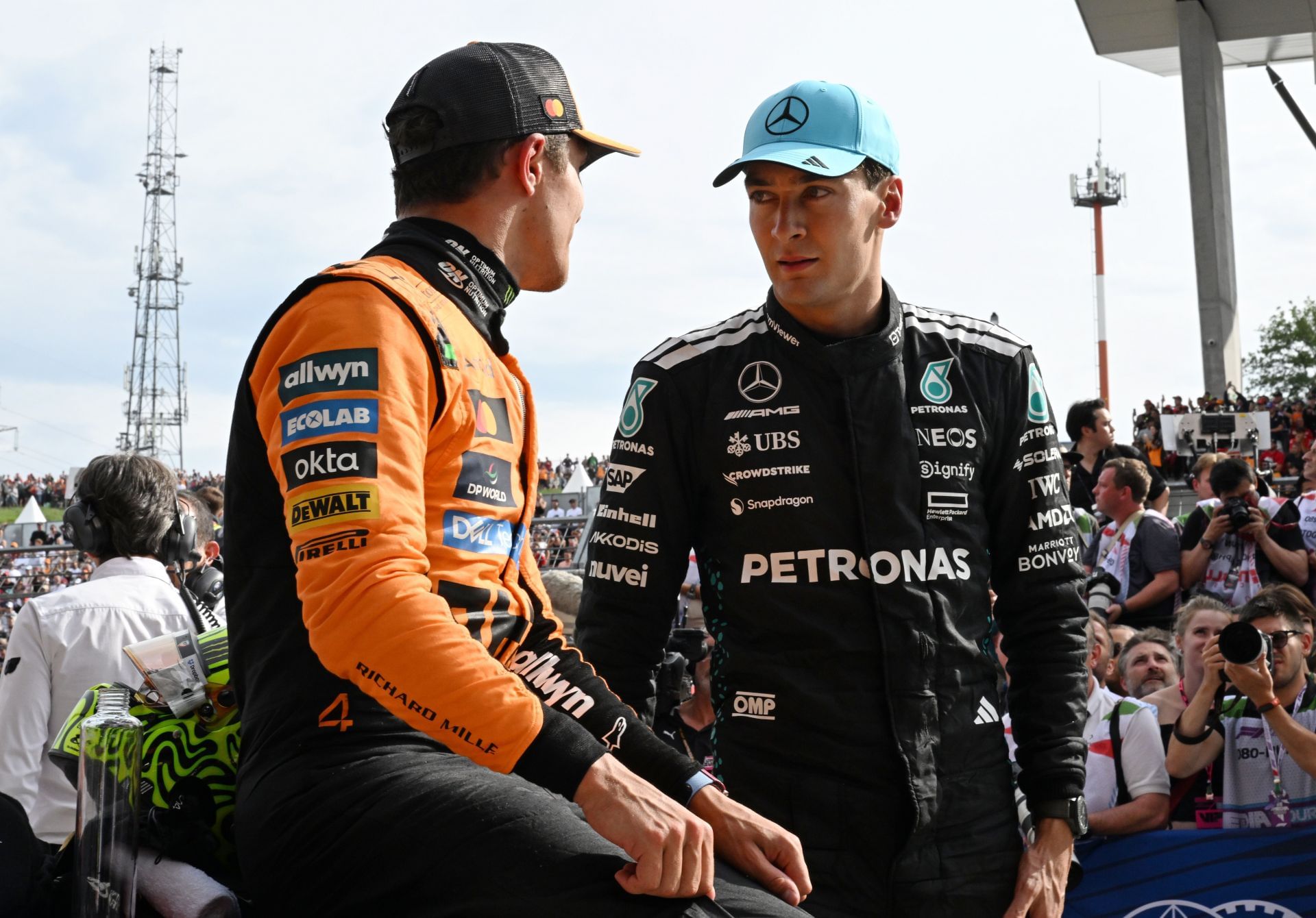 McLaren&#039;s Lando Norris (L) and Mercedes&#039; George Russell (R) at the 2025 F1 Grand Prix of Hungary - Source: Getty