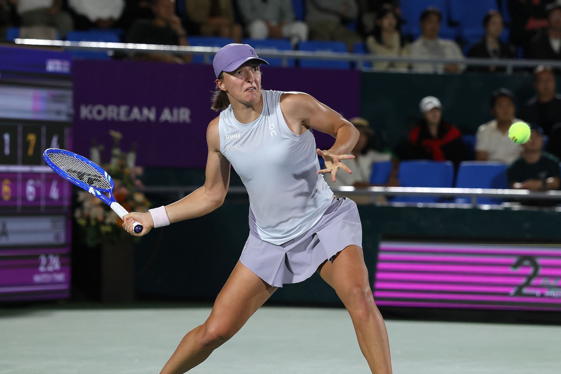 Iga Swiatek hits a forehand at Korea Open 2025 | Image Source: Getty