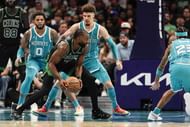 Charlotte Hornets guard LaMelo Ball (1) guards Boston Celtics guard Jaylen Brown (7) during the second half at the Spectrum Center - Source: Imagn