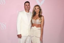 Brooks Koepka & Jena Sims pose before the Eiffel Tower as the couple enjoys time in Paris