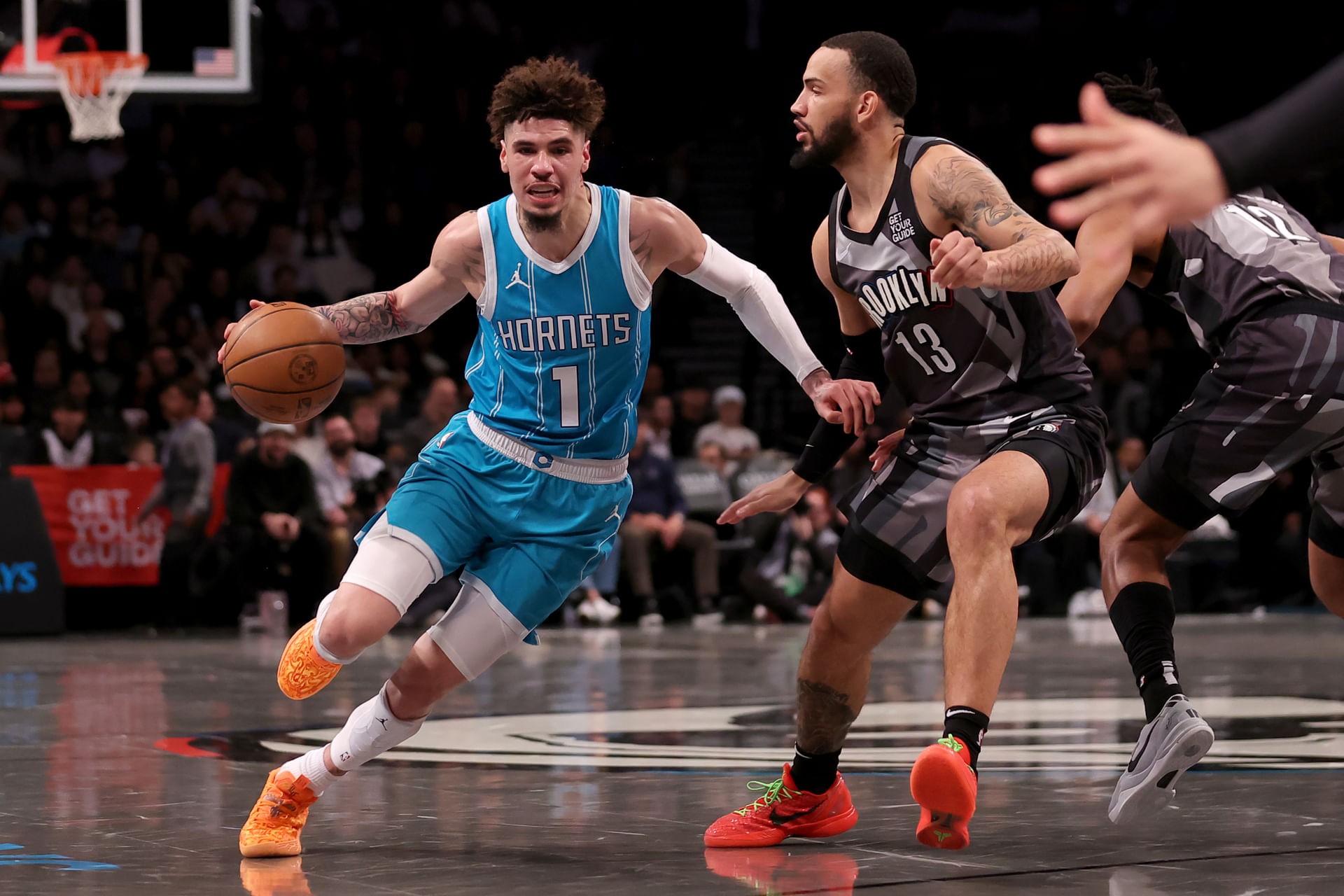 Charlotte Hornets guard LaMelo Ball (1) drives around Brooklyn Nets guard Tyrese Martin (13) during the first quarter at Barclays Center - Source: Imagn