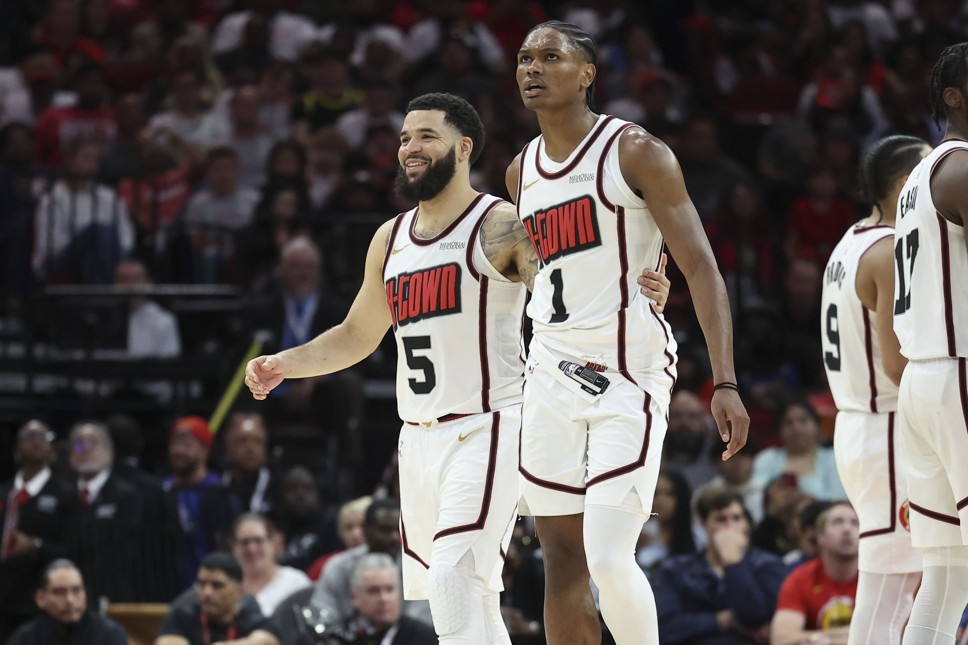 Houston Rockets guard Fred VanVleet (5) and forward Amen Thompson (1) react after a play during the third quarter against the Denver Nuggets at Toyota Center. Mandatory Credit: Troy Taormina-Imagn Images