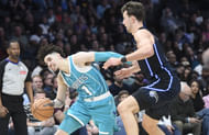 Charlotte Hornets guard LaMelo Ball (1) drives past Orlando Magic forward Franz Wagner (22) during the second half at the Spectrum Center. - Source: Imagn