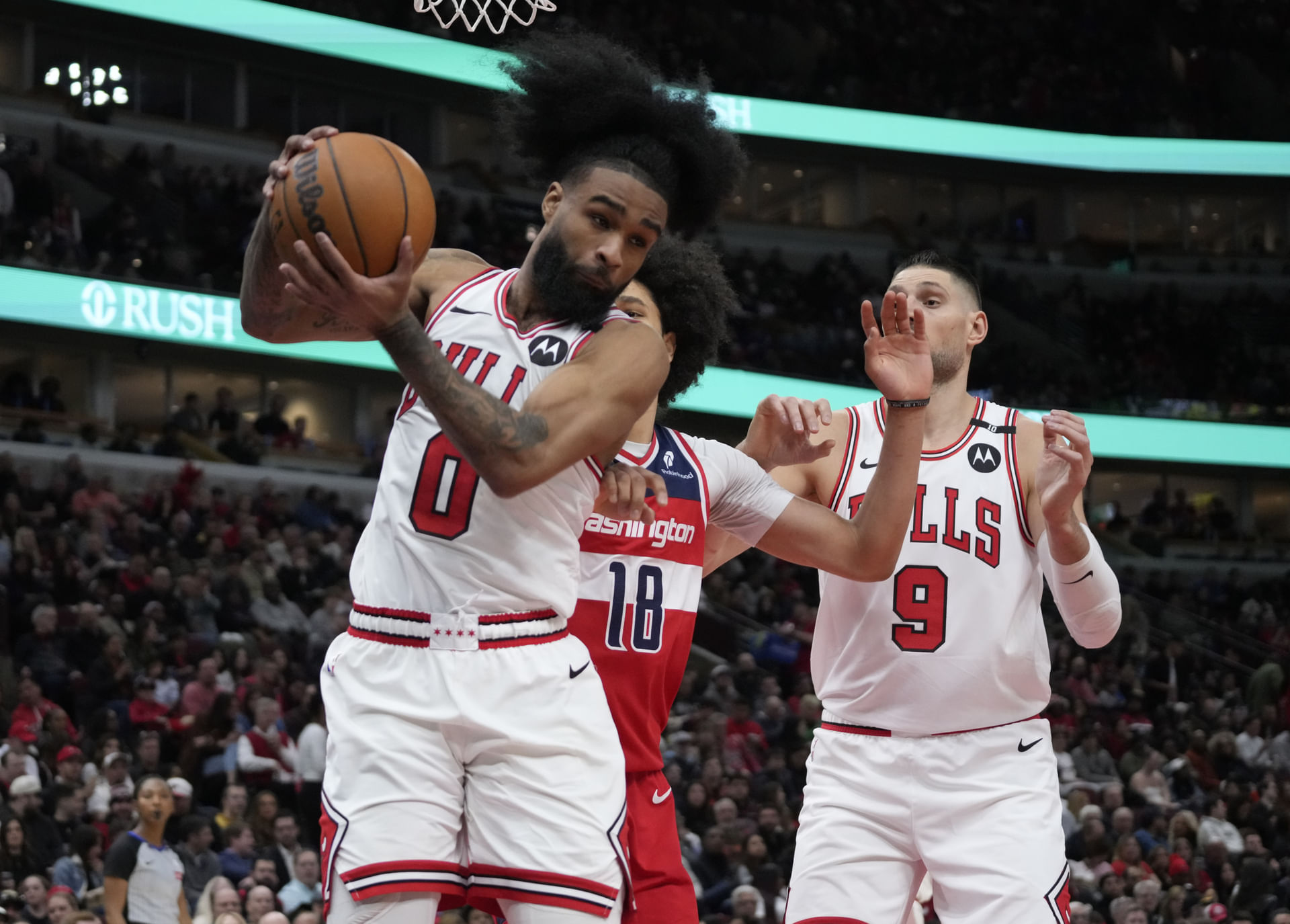 Washington Wizards forward Kyshawn George (18) defends Chicago Bulls guard Coby White (0) - Source: Imagn