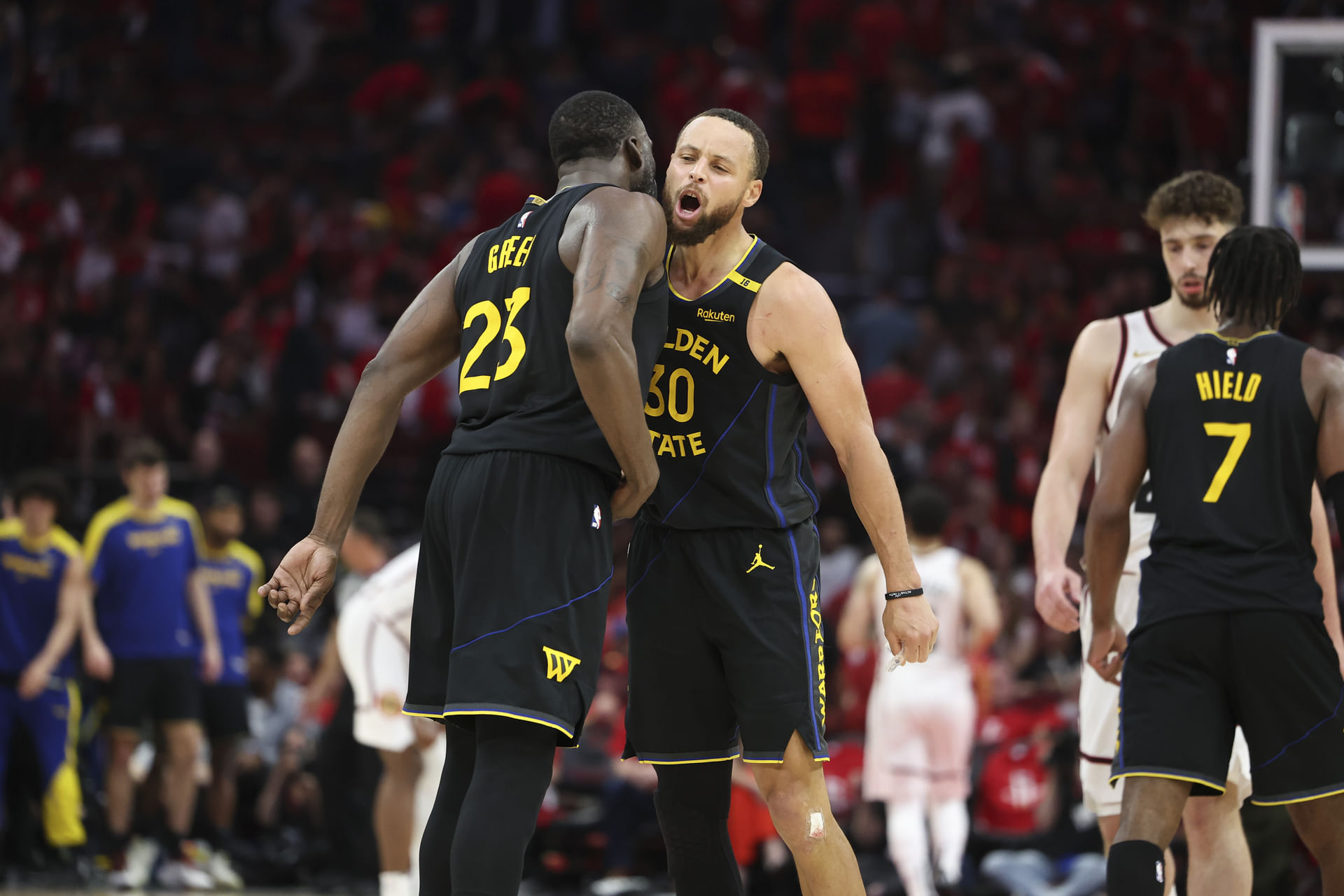 Golden State Warriors guard Stephen Curry (30) celebrates with forward Draymond Green (23) after a play during game seven of the first round for the 2025 NBA Playoffs against the Houston Rockets at Toyota Center. Mandatory - Source: Imagn