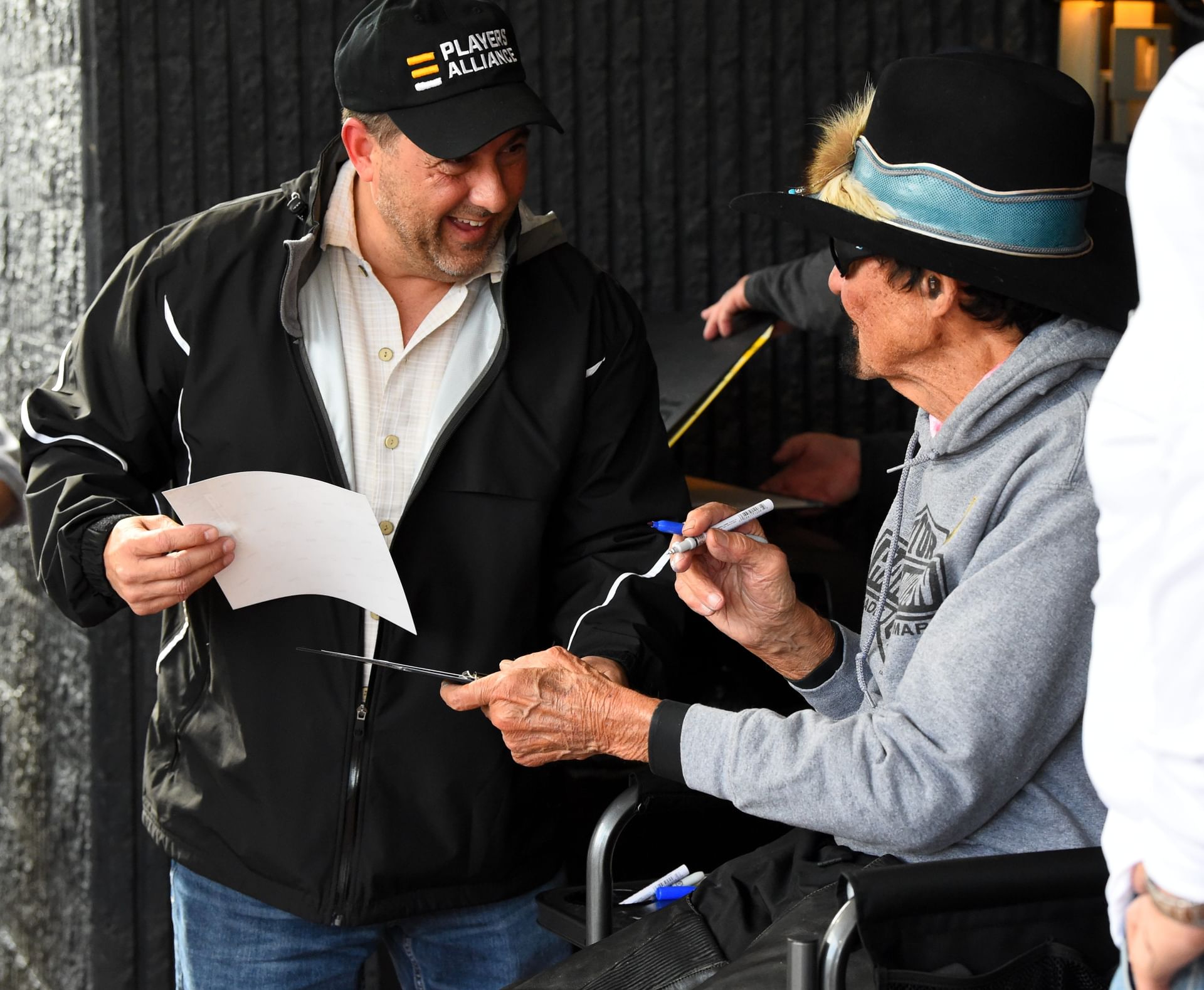 Richard Petty signed autographs and took photos with fans during the Kyle Petty Charity Ride. Syndication: Star-Gazette - Source: Imagn