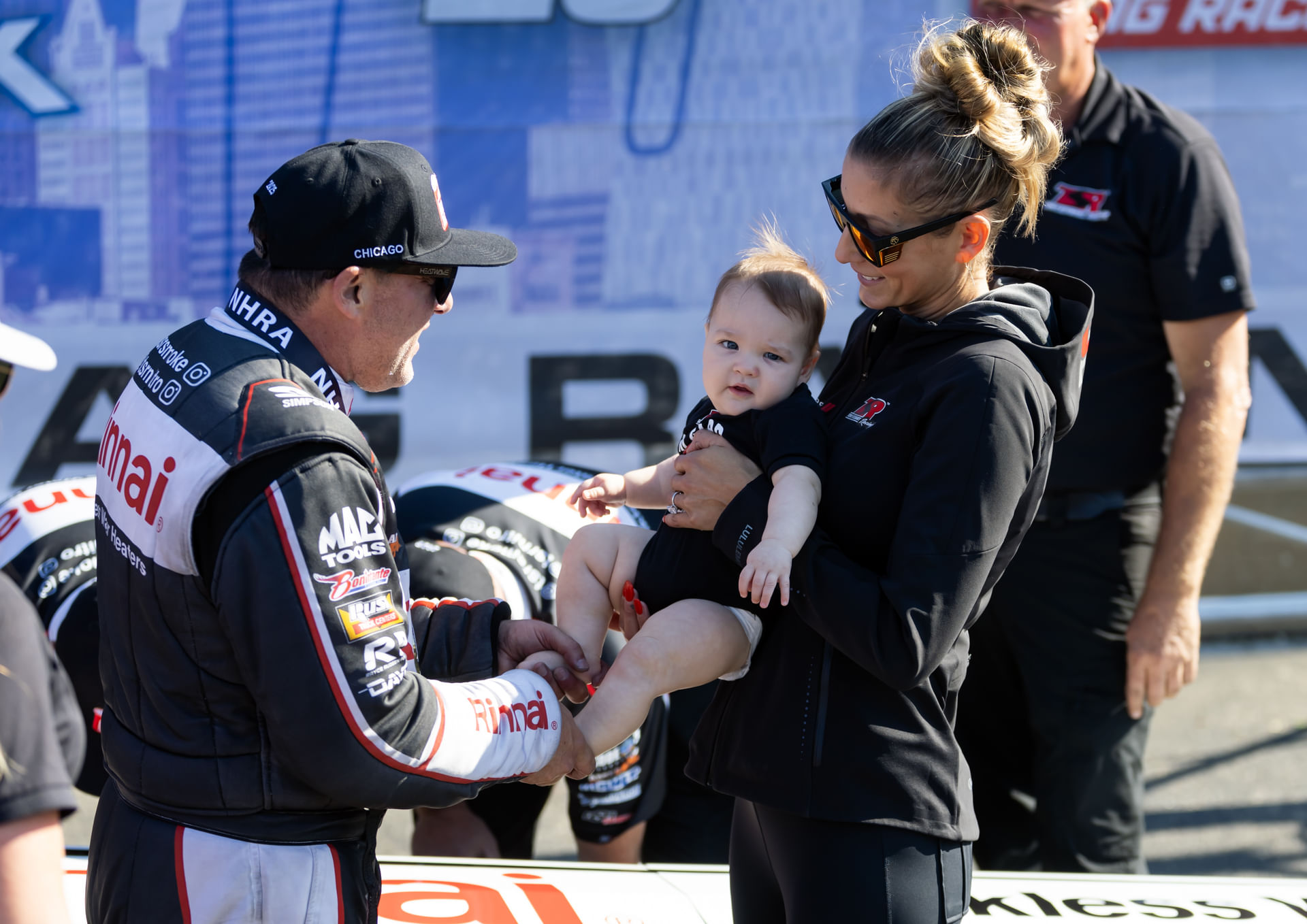 Tony Stewart celebrates with Leah Pruett and son Dominic Stewart at Route 66 Raceway. Source: Imagn