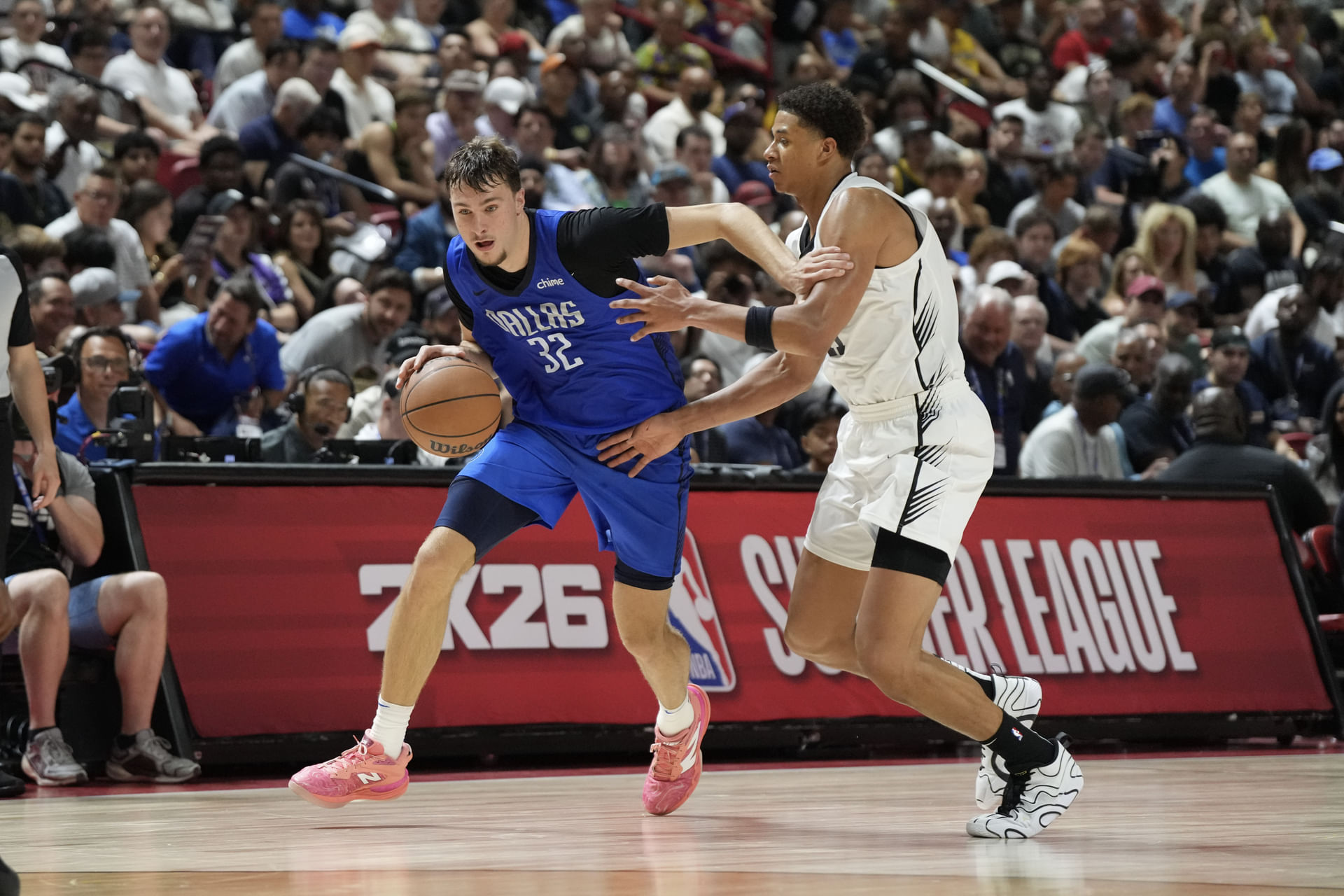 Dallas Mavericks forward Cooper Flagg (32) drives past San Antonio Spurs forward Carter Bryant (11) in the fourth quarter of their game at Thomas &amp; Mack Center. Mandatory Credit: Candice Ward-Imagn Images