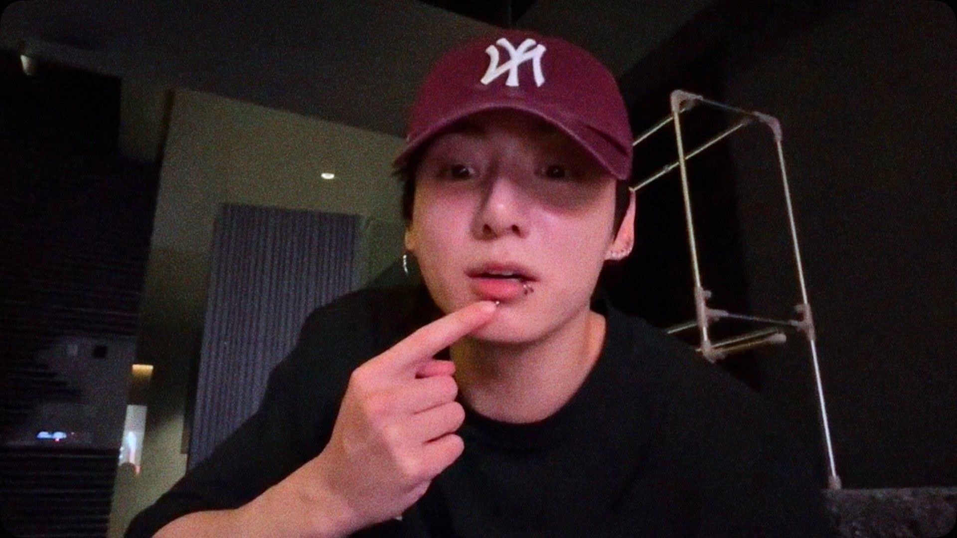 The idol showing his lip piercing (Image via Weverse)