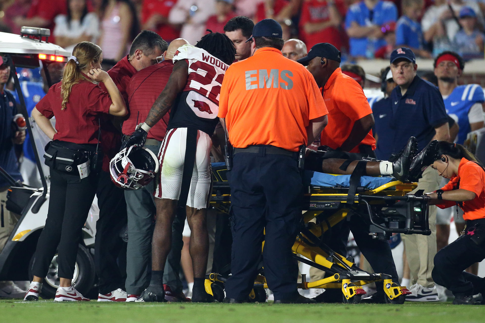 NCAA Football: Arkansas at Mississippi Sep 13, 2025; Oxford, Mississippi, USA; Arkansas Razorback defensive back Caleb Wooden (22) check on defensive back Kani Walker (13) after an injury during the fourth quarter against the Mississippi Rebels at Vaught-Hemingway Stadium. Credit: Petre Thomas-Imagn Images