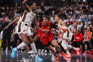 Sep 14, 2025; College Park, Georgia, USA; Atlanta Dream guard Te-Hina Paopao (2) drives on Indiana Fever forward Aliyah Boston (7) in the second quarter during game one of round one for the 2025 WNBA Playoffs at Gateway Center Arena at College Park. Mandatory Credit: Brett Davis-Imagn Images