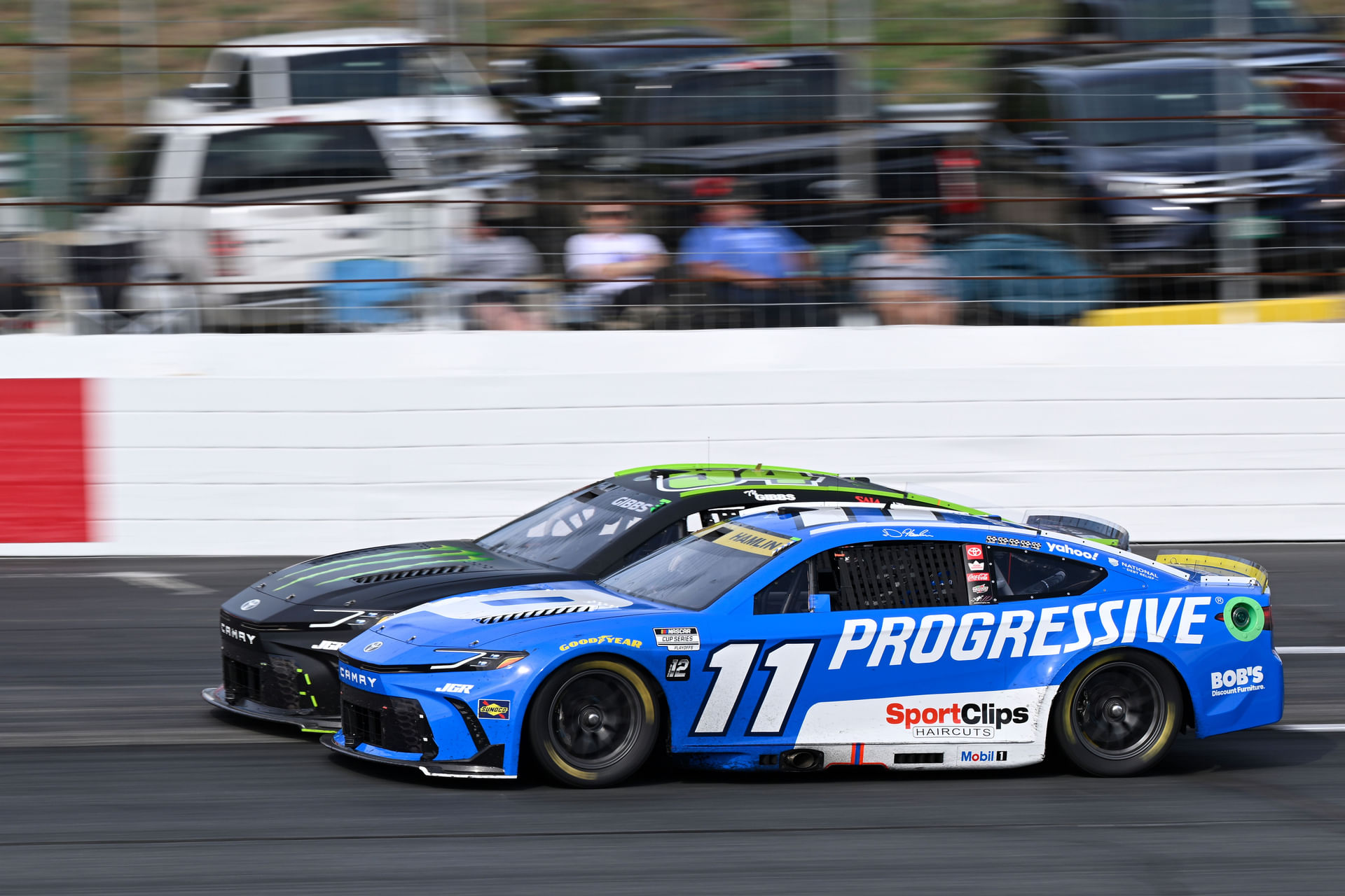 Denny Hamlin (11) and NASCAR Cup Series driver Ty Gibbs (54) race nose to nose in the Mobil 1 301 at New Hampshire Motor Speedway - Source: Imagn