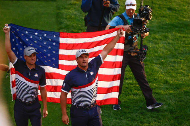 WATCH: Justin Thomas and Bryson DeChambeau walk down the Ryder Cup tunnel with an American flag draped