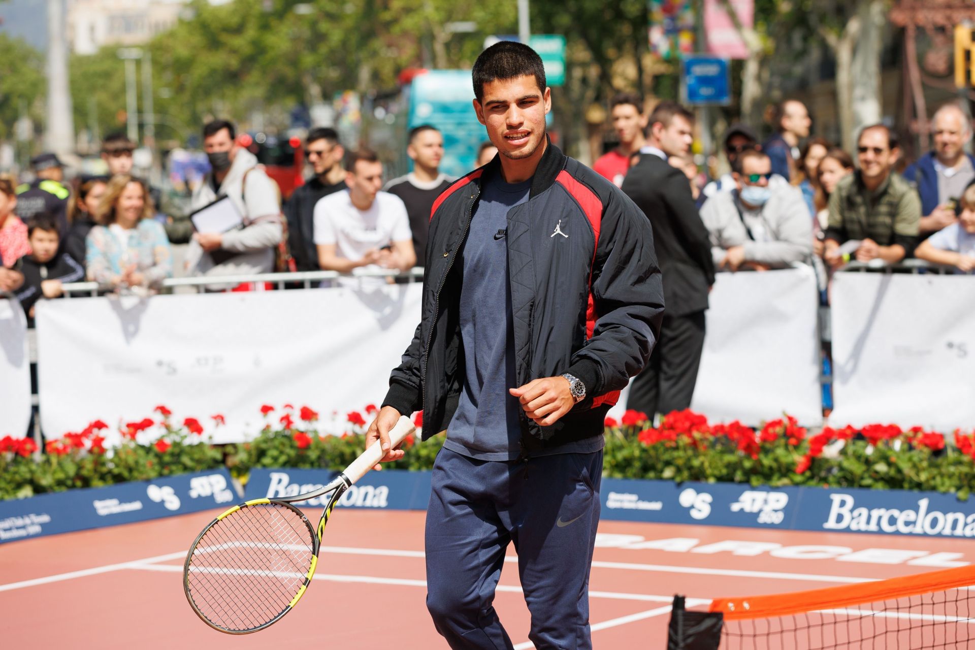 Carlos Alcaraz during an exhibition event in Barcelona wearing a Michael Jordan jacket - Source: Getty