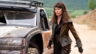 Olga Kurylenko as Drea in Afterburn, preparing for a mission in a post-apocalyptic setting. (Image via Original Films)