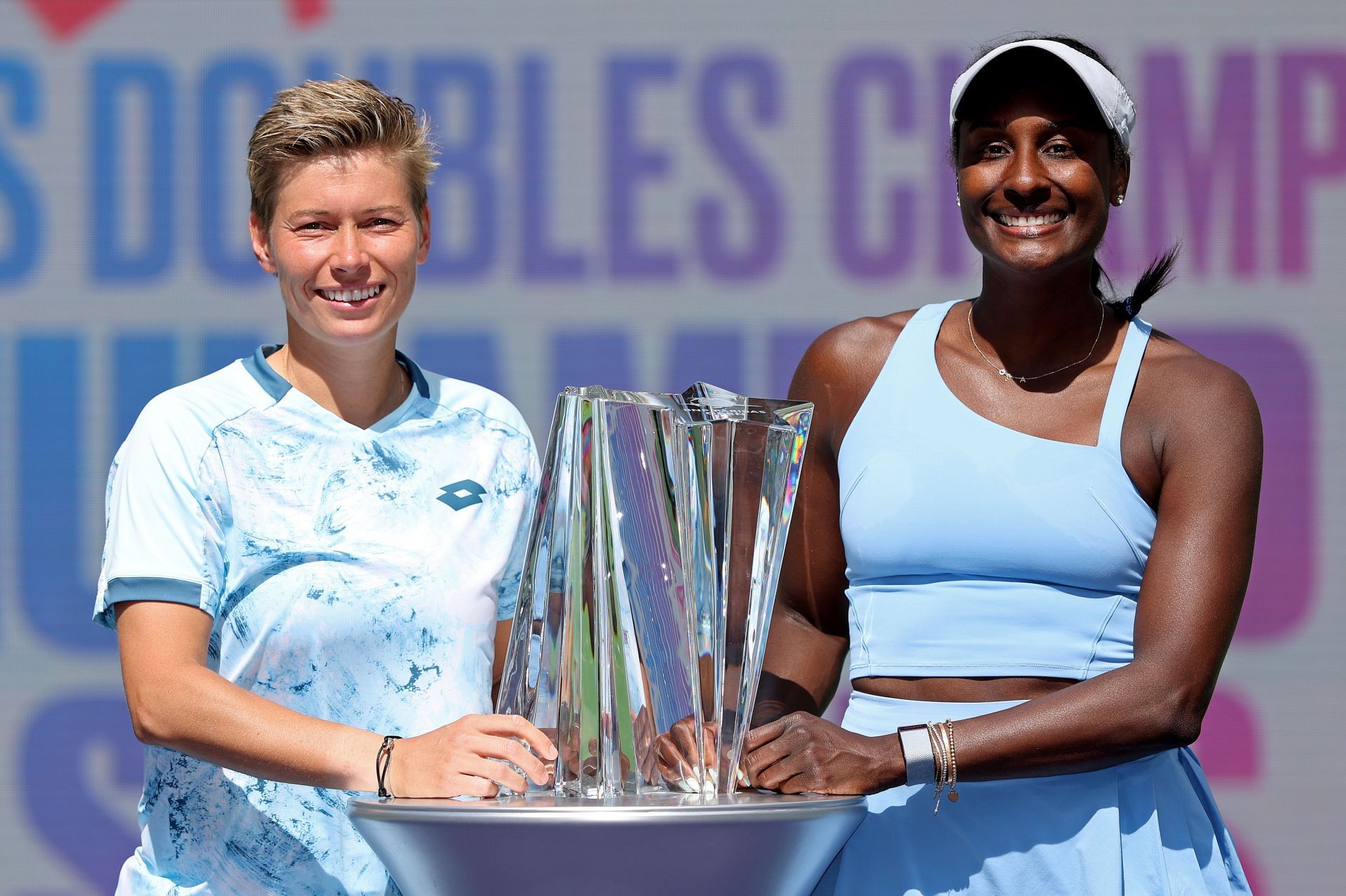 Demi Schuurs of Netherlands and Asia Muhammad of the United States pose with the trophy after defeating Tereza Mihalikova of Slovakia and Olivia Nicholls of Great Britain in the women&#039;s double final during the BNP Paribas Open at Indian Wells Tennis Garden - Source: Getty