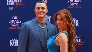 Adrian Morejon’s wife Melany gets playful as she slides down Padres star's life-size poster in red bralette and skirt