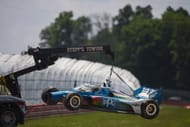 Josef Newgarden's car being lifted away at the NTT IndyCar Series Honda Indy 200 at Mid-Ohio - Source: Getty