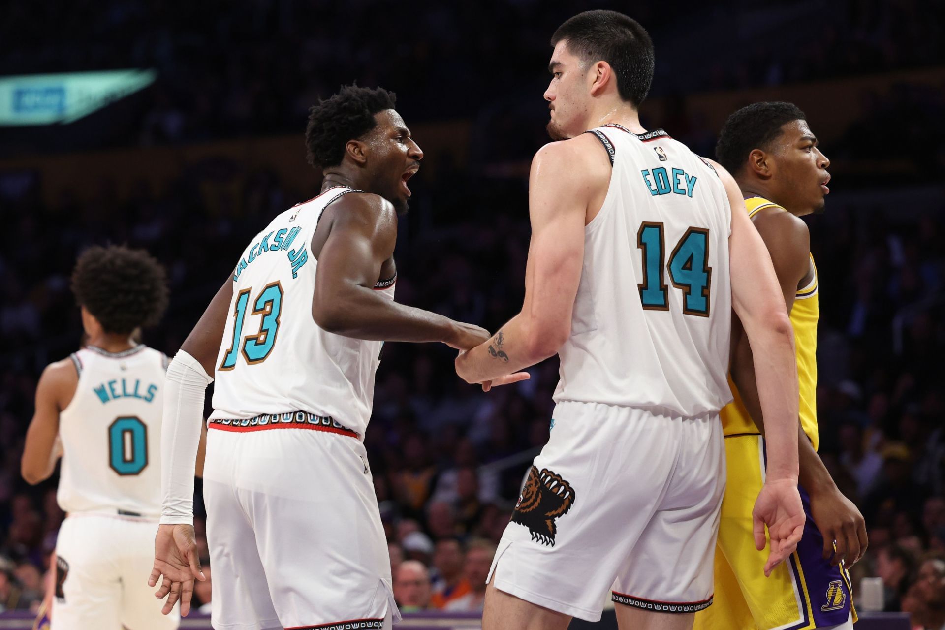 Jaren Jackson Jr. #13 and Zach Edey #14 of the Memphis Grizzlies react after a foul was called against the Los Angeles Lakers during the third quarter at Crypto.com Arena on November 13, 2024 in Los Angeles, California. NOTE TO USER: User expressly acknowledges and agrees that, by downloading and or using this photograph, User is consenting to the terms and conditions of the Getty Images License Agreement. (Photo by Harry How/Getty Images)
