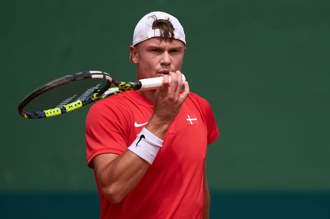 Controversy erupts at Davis Cup as Holger Rune's mid-match injury treatment makes Spain captain David Ferrer furious, complaints raised with referee
