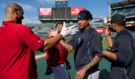Albert Pujols (L) shakes hands with Felix Hernandez (R) - Source: Getty