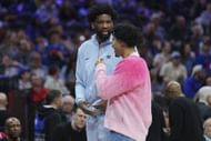Joel Embiid #21 of the Philadelphia 76ers talks to Jared McCain - Source: Getty